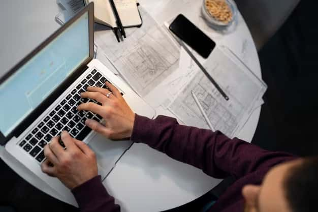 Man working at a computer, top view